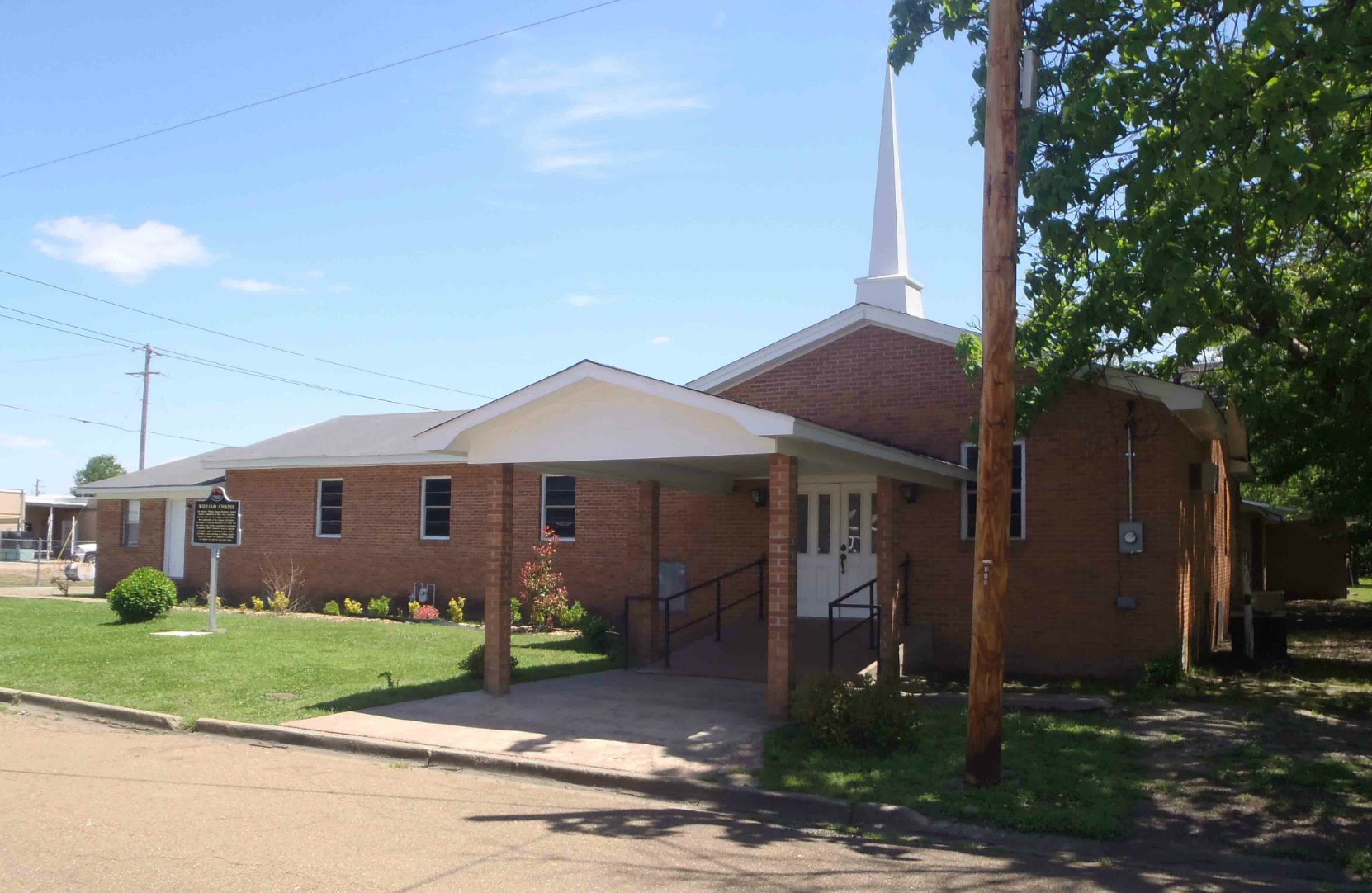 William Chapel Missionary Baptist Church, Ruleville, Mississippi. The Mississippi Freedom Trail marker is visible on the lawn in front of the church.