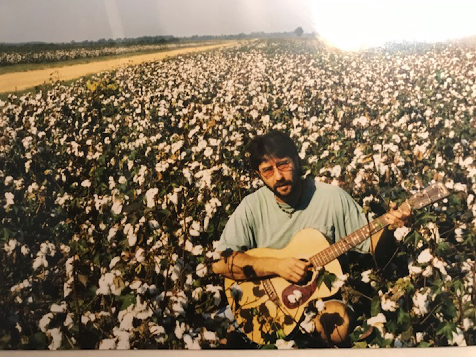 Larry Amato in the Stovall Farms cotton fields near the site Muddy Waters cabin, Clarksdale, Mississippi, circa 1990's (photo: Larry Amato)