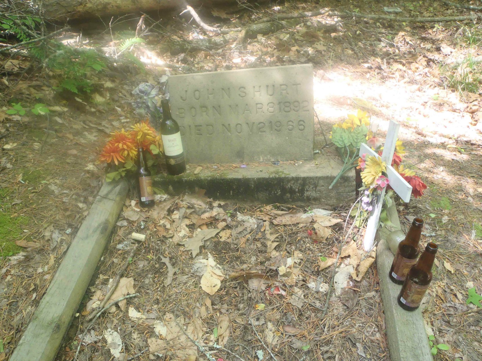 Mississippi John Hurt's grave, Avalon, Mississippi, with tributes left by fans.