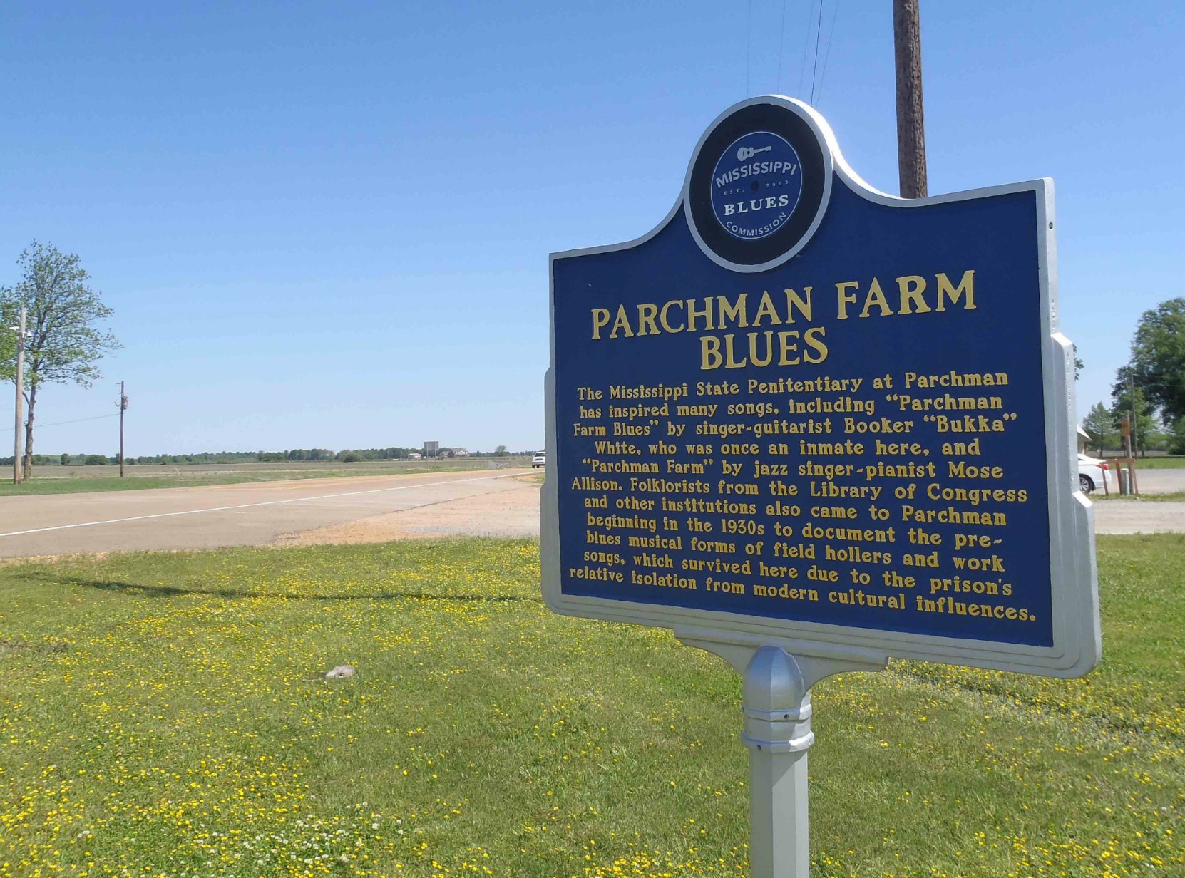 Miississippi Blues Trail marker for Parchman Farm Blues near the main gate of the Mississippi State Penitentiary