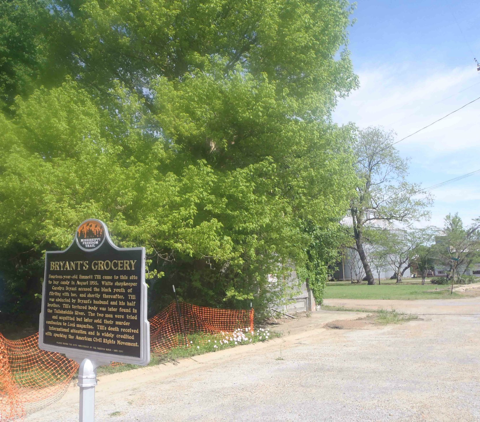 The site of Bryant's Grocery, Money, Leflore County, Mississippi. This ruins of the former Bryant's Grocery building are behind the trees to the rear of the Freedom Trail marker.