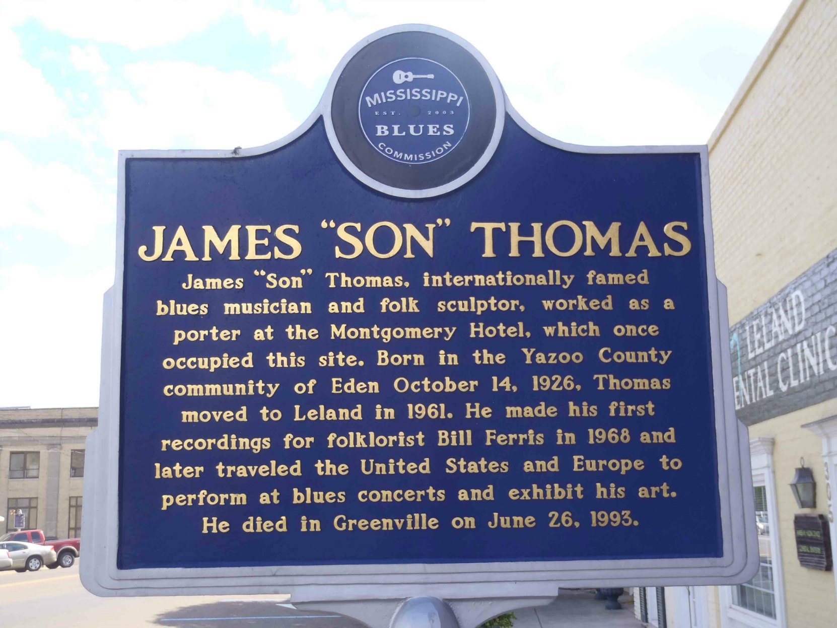 Mississippi Blues Trail marker for James "Son" Thomas, North Broad Street, Leland, Mississippi. There is also a Mississippi Blues Trail marker for Johnny Winter on the opposite side of the street.