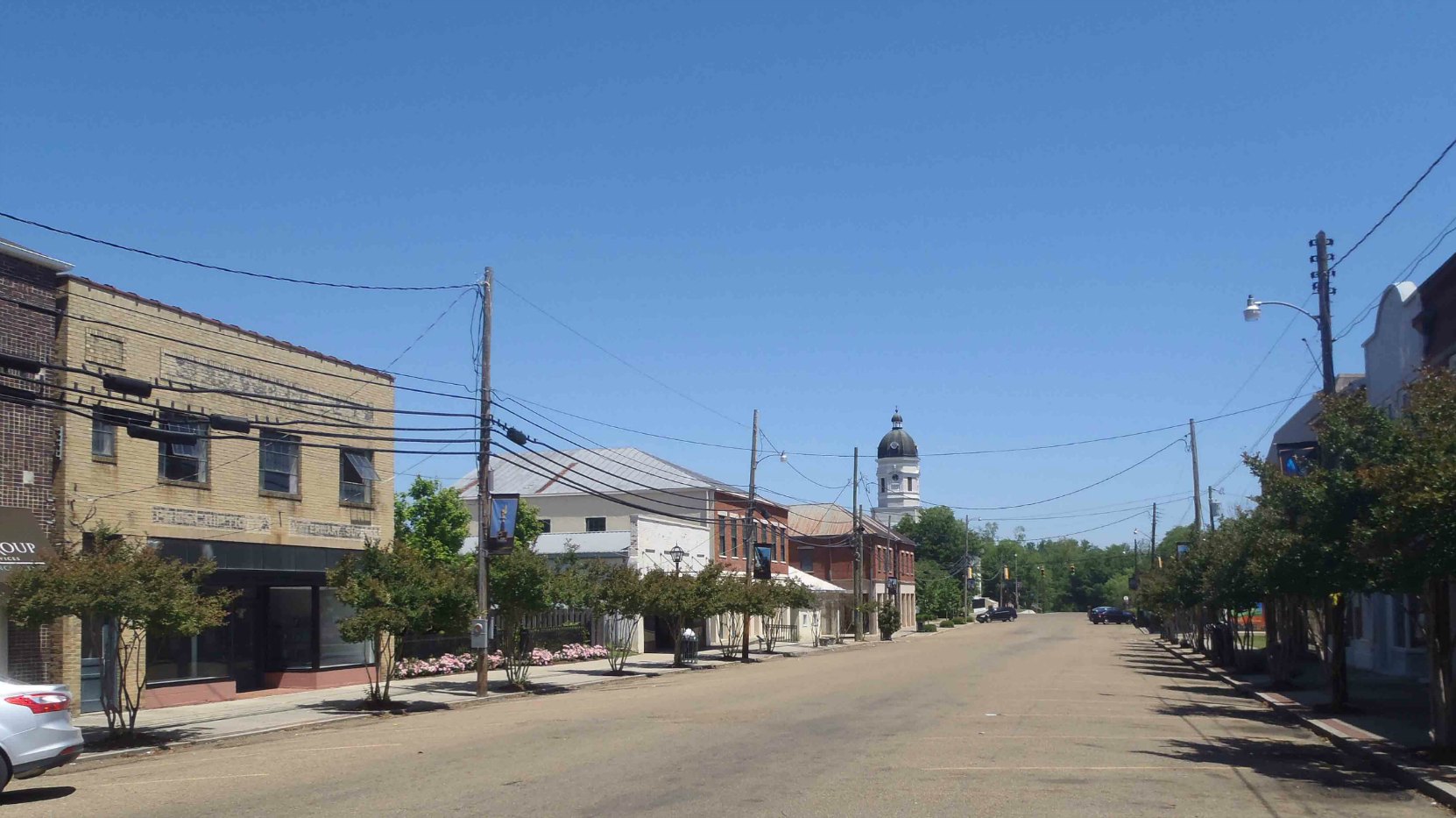 Market Street, the main downtown street in Port Gibson, Claiborne County, Mississippi. The tower of the Claiborne County Courthouse is visible in the background.