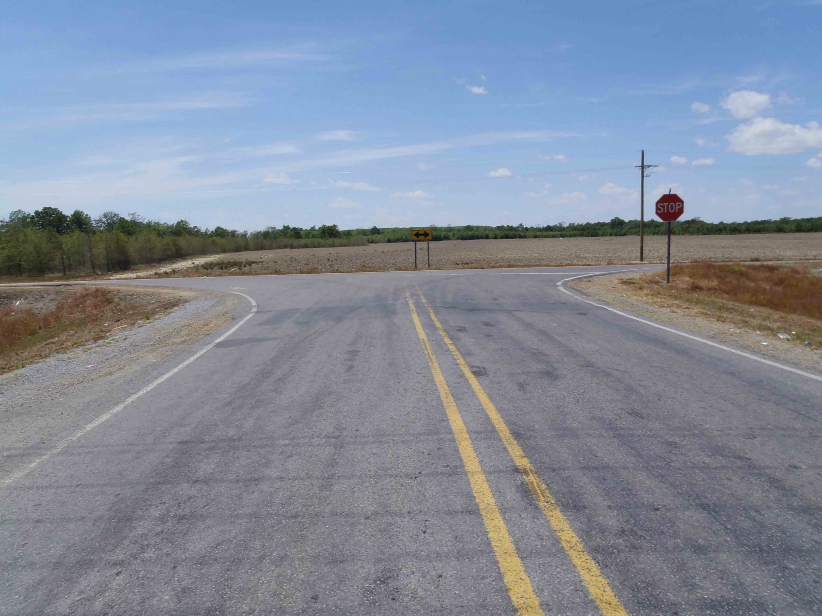 The second reputed site of Robert Johnson's poisoning in 1938, Highway 7 and Leflore County Road 512, near Quito, Leflore County, Mississippi, looking west.