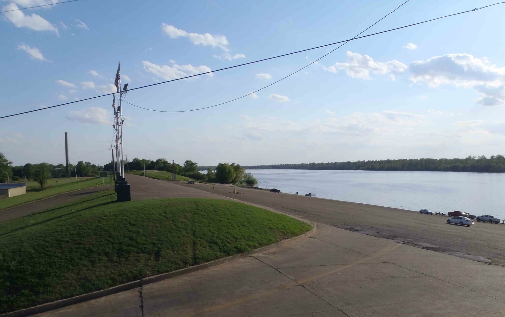 The top of the Mississippi River levee at Greenville, Mississippi. The cars on the right of the photo give an indication of the height of the levee at Greenville.